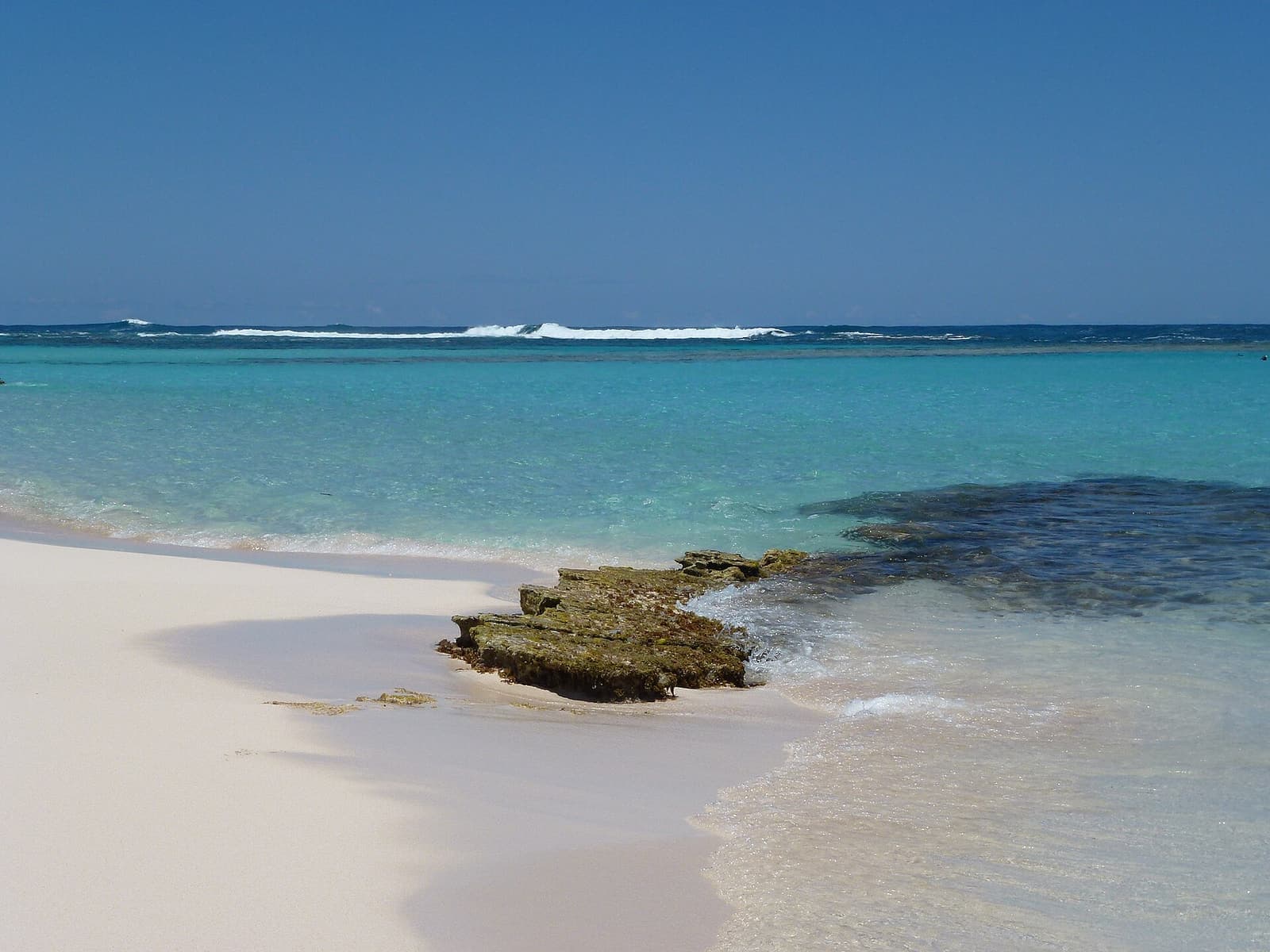 A white sand beach and turquoise water at Loblolly Bay, Anegada